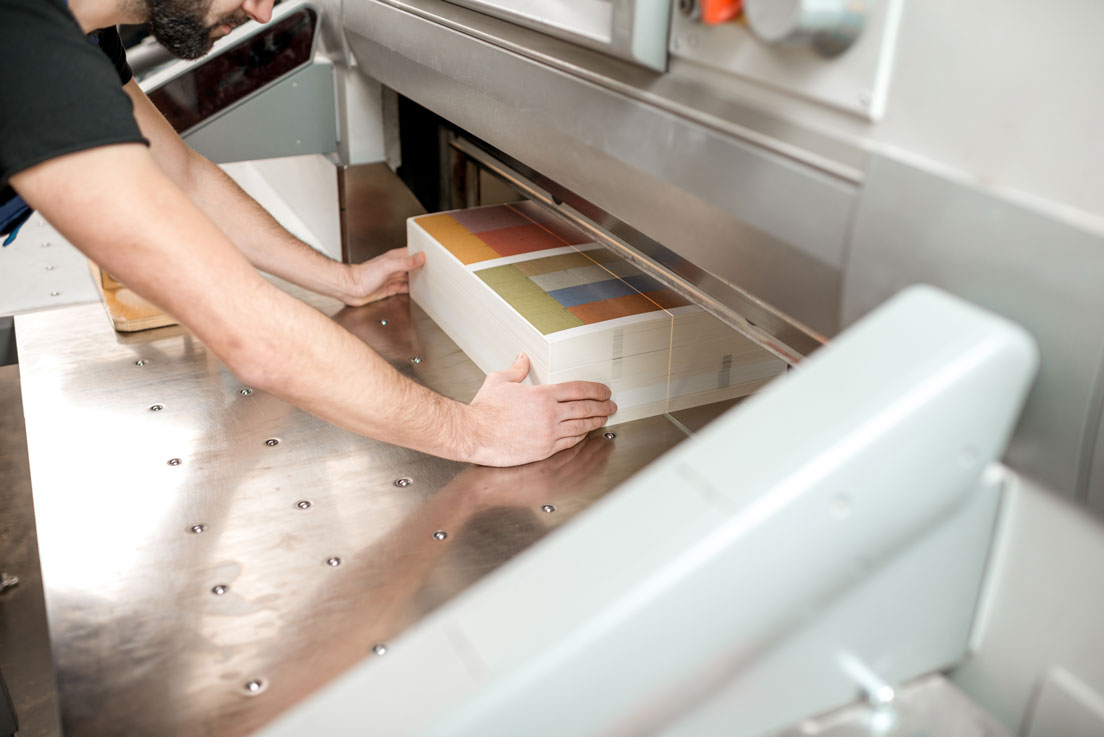 cutting-a-stack-of-paper-for-printing